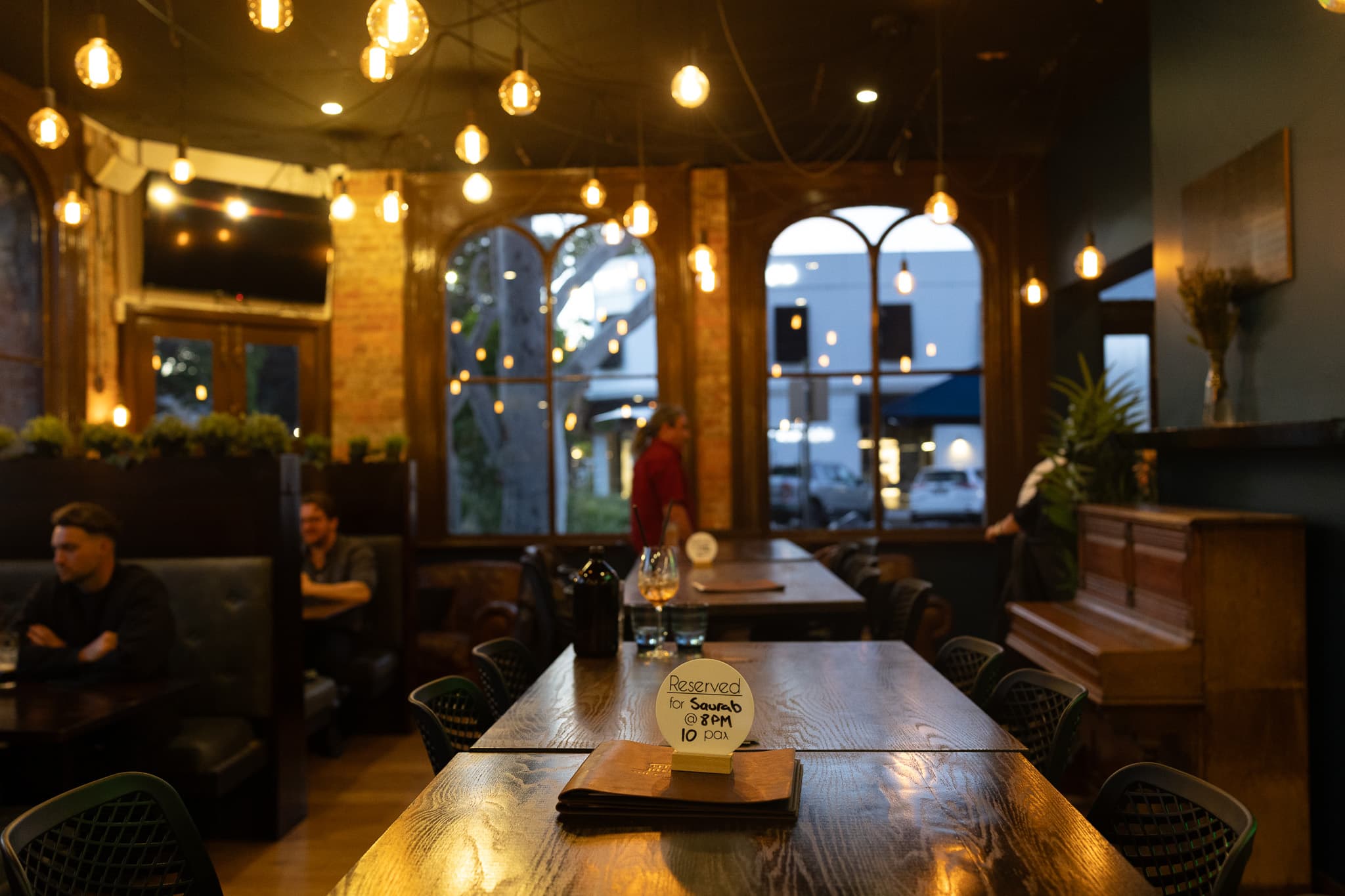 The warmly lit dining room at The Cornerstone Pub
