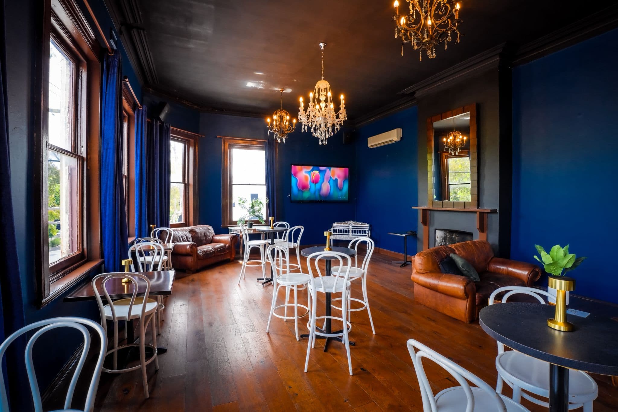 The blue-walled Function Room at The Cornerstone Pub